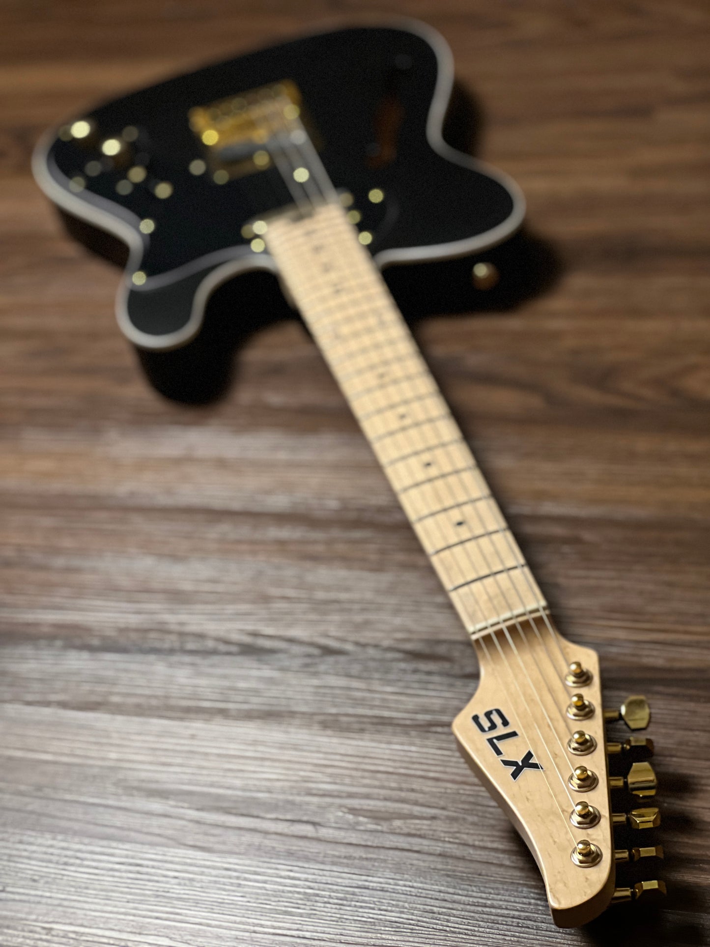 SLX Raven Thinline Deluxe in Black Satin with Maple FB and Gold Hardware