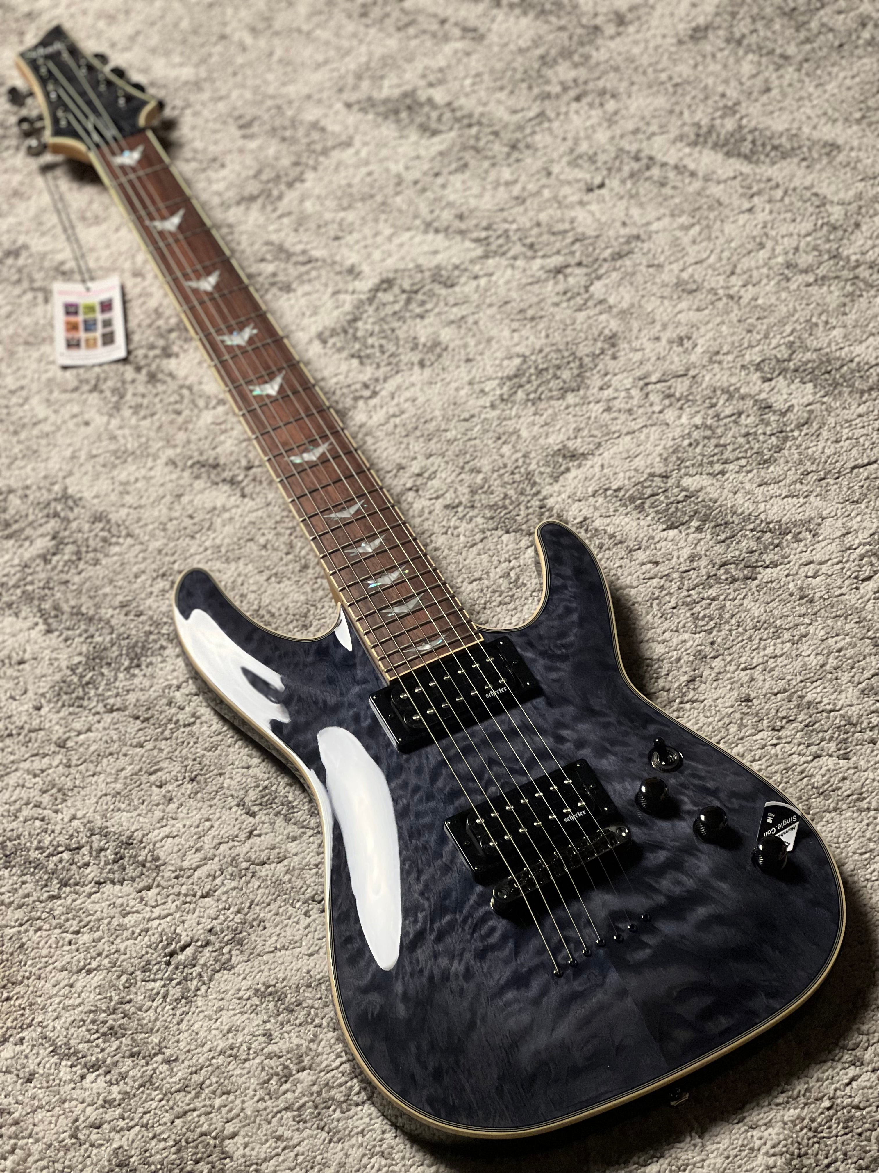 Schecter Omen Extreme-7 in See Thru Black – nafiriguitar.com