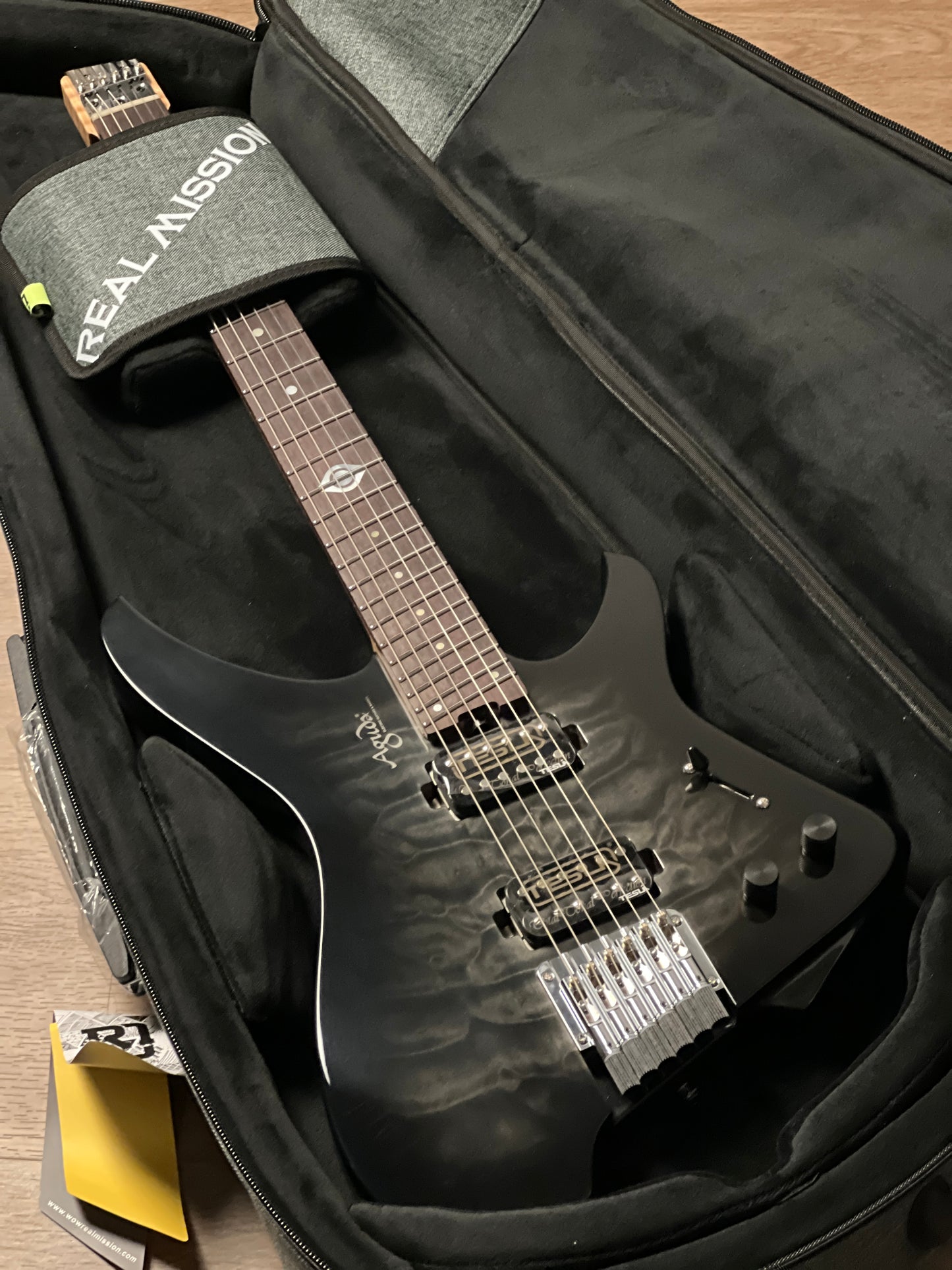 Aguda Black Hole Deluxe in Transparent Black Burst with Quilt Top and Black Pickups