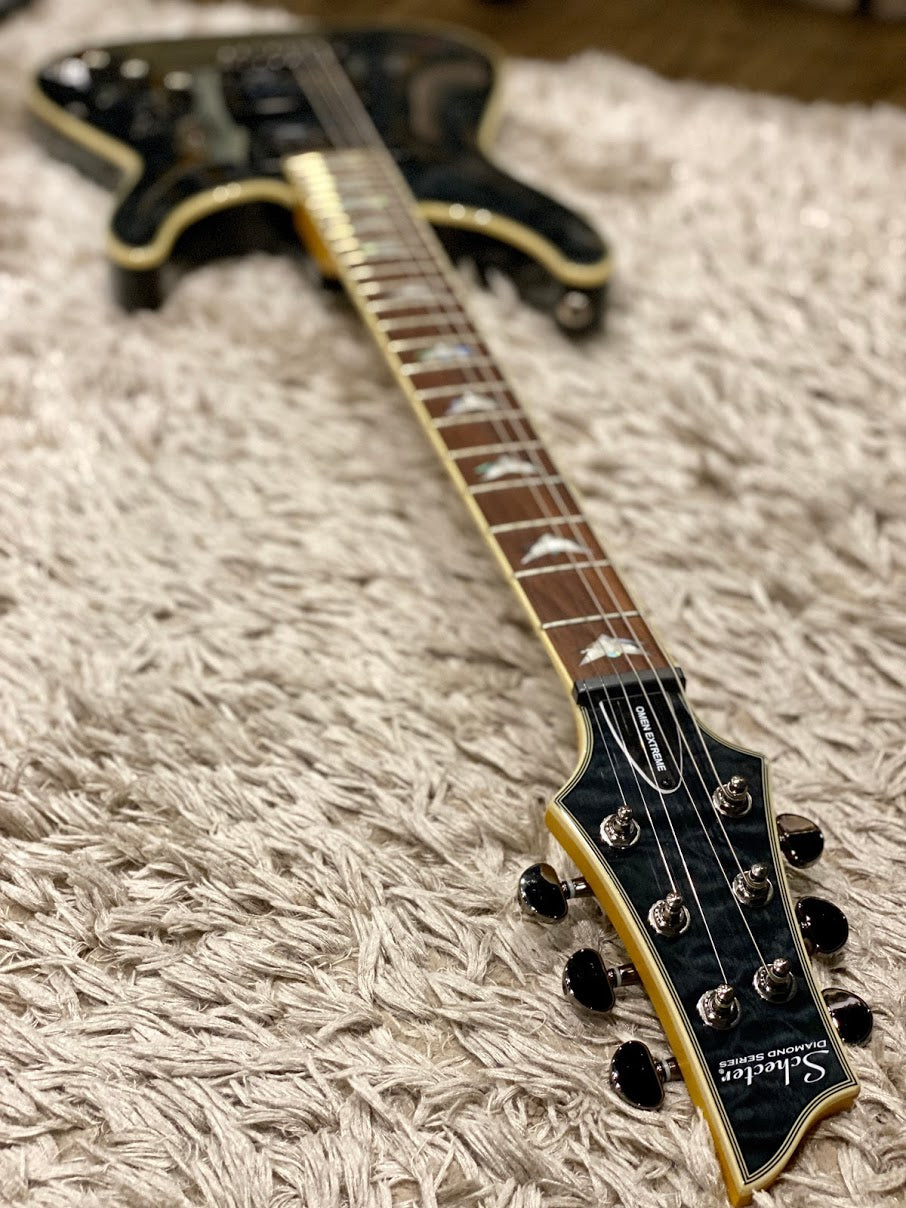 Schecter Omen Extreme-6 in Seethru Black