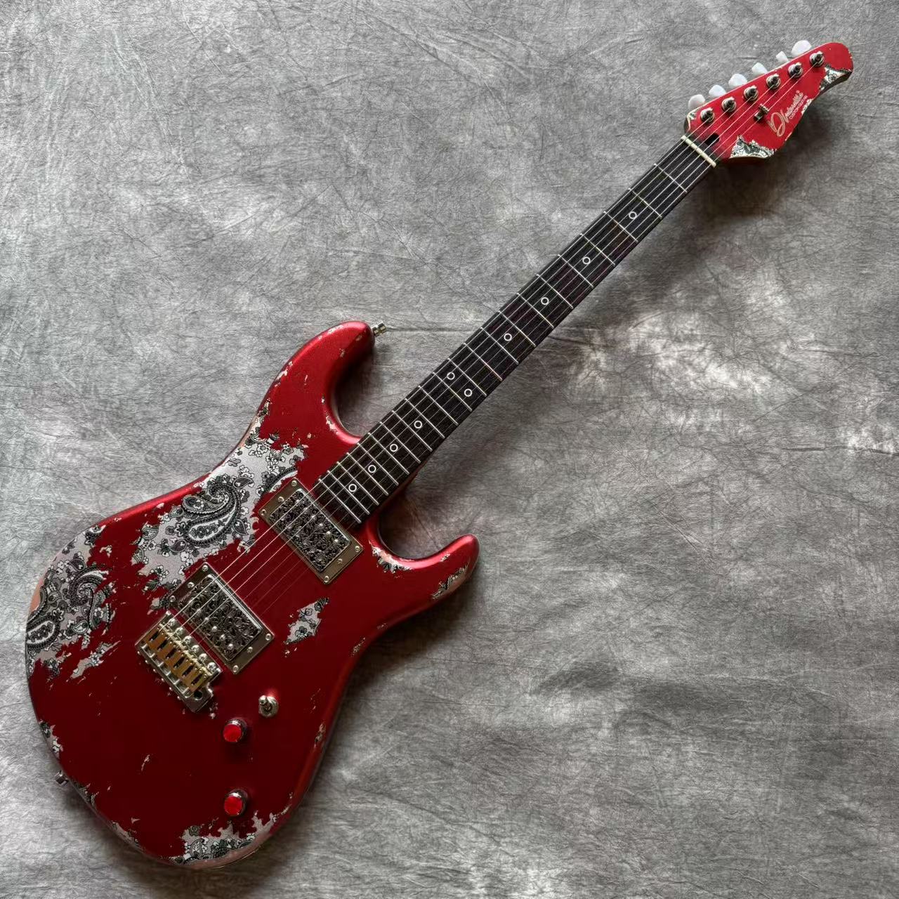 Dhatarattha Performance DST HH in Candy Apple Red over Black Paisley with RW FB and Nitrocellulose Lacquer Relic