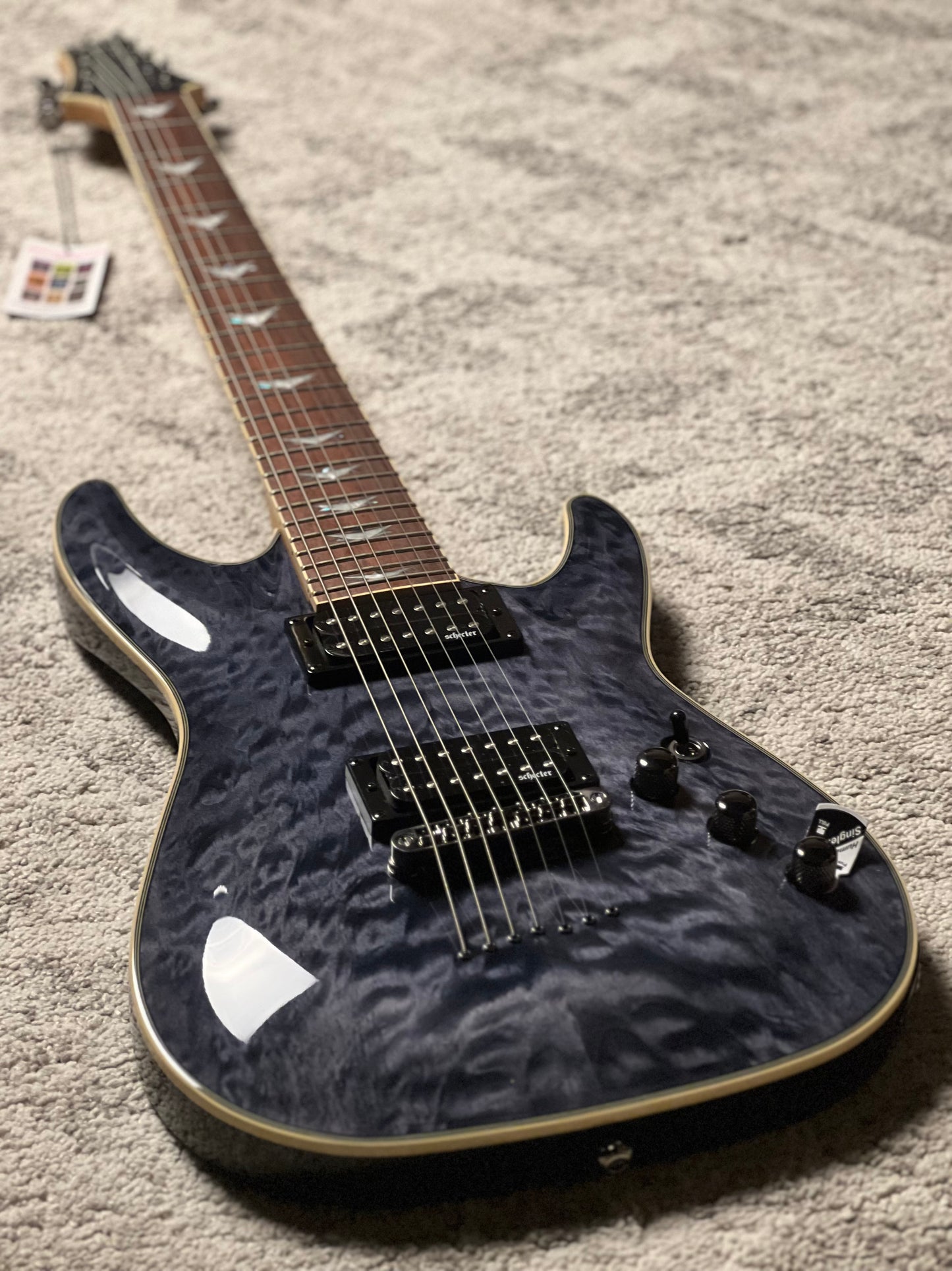 Schecter Omen Extreme-7 in See Thru Black