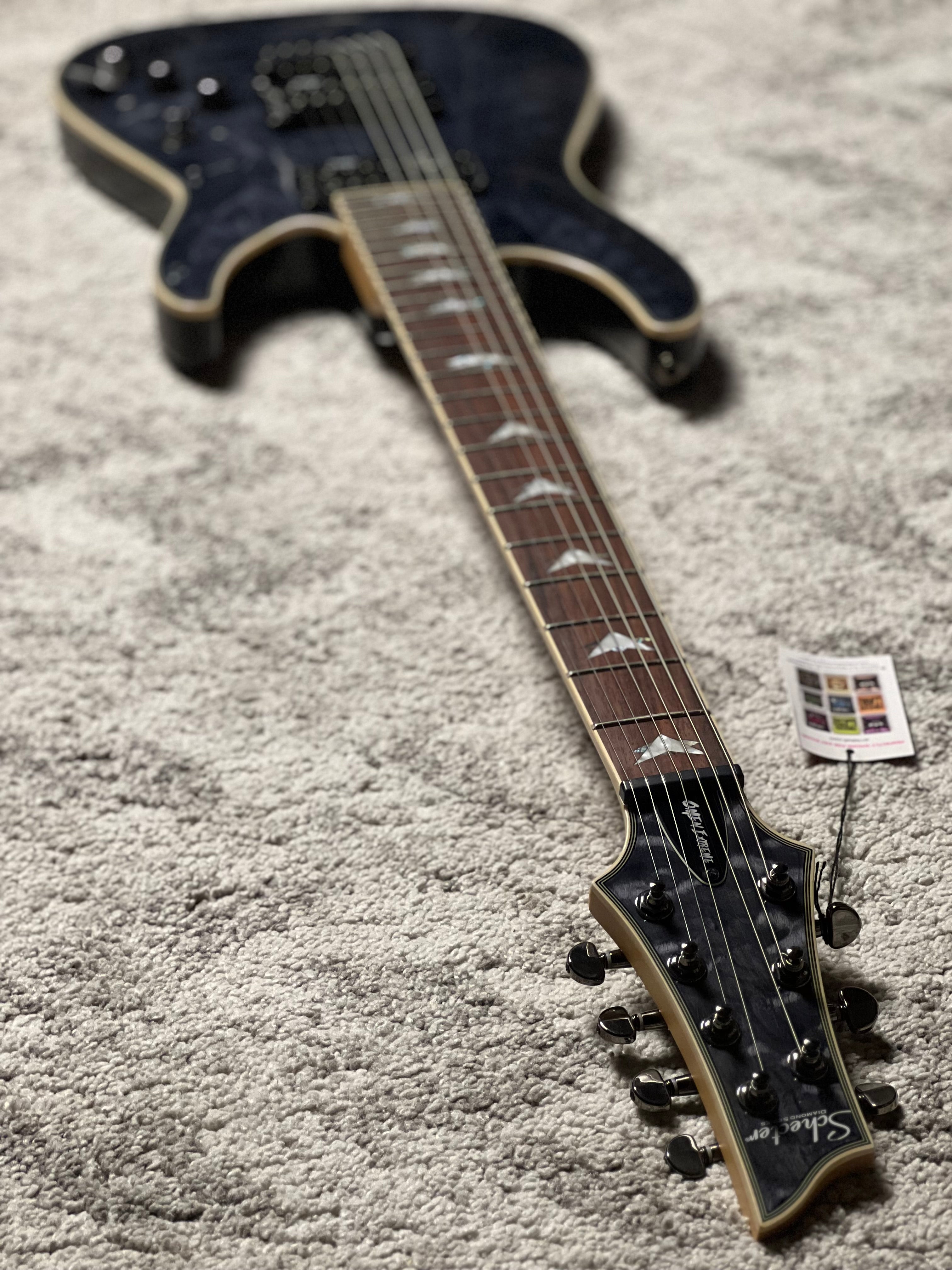Schecter Omen Extreme-7 in See Thru Black – nafiriguitar.com