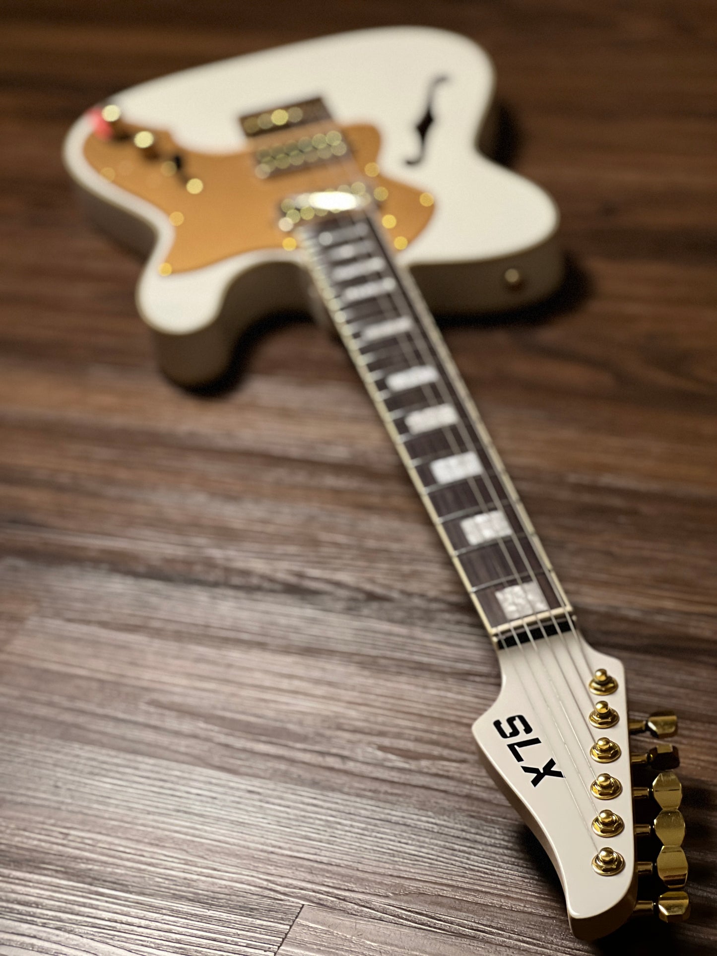 SLX Raven Thinline Super Deluxe in Olympic White with Rosewood FB and Gold Hardware