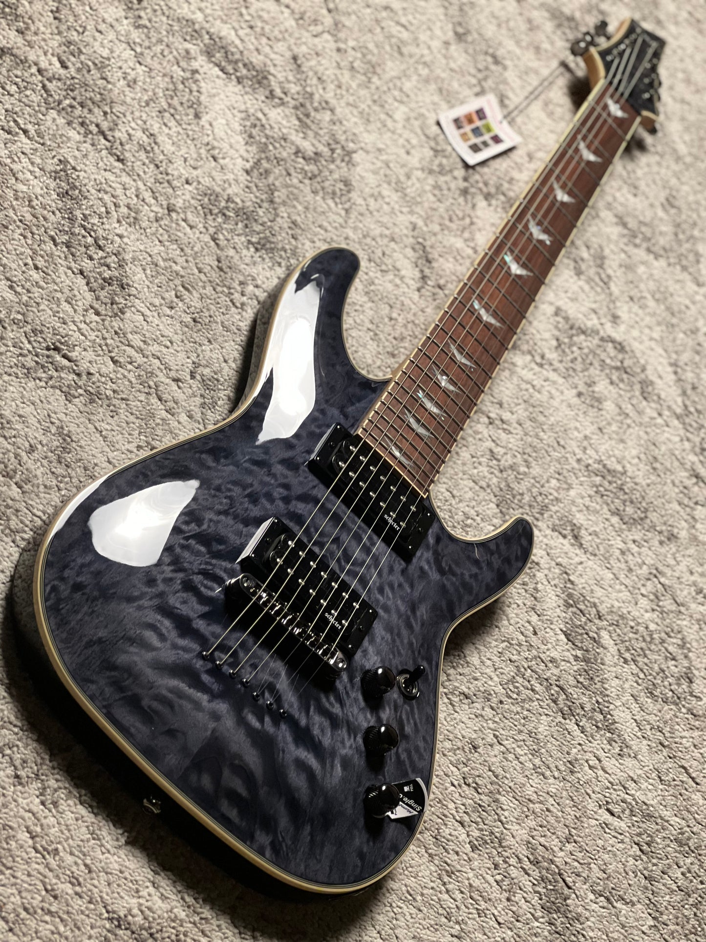 Schecter Omen Extreme-7 in See Thru Black